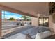 Covered patio view to the backyard with desert landscaping and water feature at 10309 E Twilight Ct, Sun Lakes, AZ 85248
