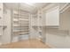 Spacious walk-in closet with ample shelving and hanging space for organized storage at 10309 E Twilight Ct, Sun Lakes, AZ 85248