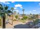 Scenic aerial view showcases the neighborhood, landscaping, city skyline, and palm tree lined streets at 17 W Vernon Ave # 316, Phoenix, AZ 85003