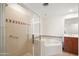 Bright bathroom showcasing a shower, bathtub, and vanity with good lighting at 17 W Vernon Ave # 316, Phoenix, AZ 85003
