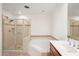 Bright bathroom featuring a shower, bathtub, and vanity with lots of lighting at 17 W Vernon Ave # 316, Phoenix, AZ 85003