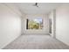 Spacious bedroom with large window and lots of light and plush neutral carpet at 17 W Vernon Ave # 316, Phoenix, AZ 85003