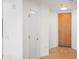 Entryway featuring a white door, wood door, and neutral tile flooring at 17 W Vernon Ave # 316, Phoenix, AZ 85003