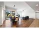 Bright, open-concept living and dining room with a fireplace and balcony access at 17 W Vernon Ave # 316, Phoenix, AZ 85003