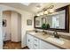 Double vanity bathroom with granite countertops and large mirror at 18719 E Avenida Del Ray --, Rio Verde, AZ 85263