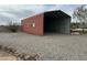 Open carport with gravel base and metal roof, offering convenient vehicle storage at 38406 N 12Th Ave, Phoenix, AZ 85086