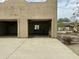 View of the spacious garage with two bays, with an organizational area, in this home's exterior at 38406 N 12Th Ave, Phoenix, AZ 85086
