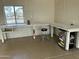 Garage interior featuring epoxy flooring, peg board, and work bench at 38406 N 12Th Ave, Phoenix, AZ 85086