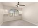Bright, airy bedroom featuring a ceiling fan, large window and decorative shelving at 5450 E Mclellan Rd # 204, Mesa, AZ 85205