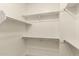 Walk-in closet with multiple levels of storage shelving and racks at 5450 E Mclellan Rd # 204, Mesa, AZ 85205