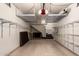 Spacious garage with ample storage shelving and potential for workshop space at 5450 E Mclellan Rd # 204, Mesa, AZ 85205