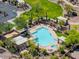Aerial view of community pool, spa, and surrounding landscape at 6960 E Hacienda La Noria Ln, Gold Canyon, AZ 85118