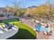 Aerial view of backyard oasis with putting green at 6960 E Hacienda La Noria Ln, Gold Canyon, AZ 85118