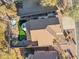 Aerial view of house, showcasing backyard and putting green at 6960 E Hacienda La Noria Ln, Gold Canyon, AZ 85118