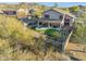 Two story house with a putting green and covered patio at 6960 E Hacienda La Noria Ln, Gold Canyon, AZ 85118