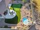 Backyard with putting green, spa, and patio area at 6960 E Hacienda La Noria Ln, Gold Canyon, AZ 85118