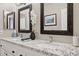 Bathroom with granite countertops, double sinks, and framed mirrors at 6960 E Hacienda La Noria Ln, Gold Canyon, AZ 85118