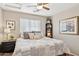 Bedroom with a queen-size bed and built-in shelving at 6960 E Hacienda La Noria Ln, Gold Canyon, AZ 85118