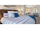 Main bedroom with wood bed frame and blue bedding at 6960 E Hacienda La Noria Ln, Gold Canyon, AZ 85118