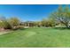 Scenic community park with grassy lawn, covered pavilion, and mature trees at 6960 E Hacienda La Noria Ln, Gold Canyon, AZ 85118