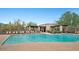 Large community swimming pool with ample lounge chairs at 6960 E Hacienda La Noria Ln, Gold Canyon, AZ 85118
