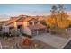 Two-story house with tile roof, three-car garage, and mountain views at 6960 E Hacienda La Noria Ln, Gold Canyon, AZ 85118