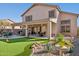 Two-story home with covered patio and putting green at 6960 E Hacienda La Noria Ln, Gold Canyon, AZ 85118