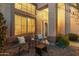 Inviting front entry with seating area, illuminated at night at 6960 E Hacienda La Noria Ln, Gold Canyon, AZ 85118