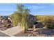 Two story house with a large tree in front at 6960 E Hacienda La Noria Ln, Gold Canyon, AZ 85118