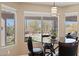 Bright kitchen nook with a glass table and chairs, backyard view at 6960 E Hacienda La Noria Ln, Gold Canyon, AZ 85118
