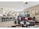Open floor plan with kitchen island, living room and gray couch at 6960 E Hacienda La Noria Ln, Gold Canyon, AZ 85118