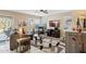 Living room with cozy seating and views to backyard at 6960 E Hacienda La Noria Ln, Gold Canyon, AZ 85118