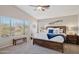 Spacious main bedroom with large window and wood bed frame at 6960 E Hacienda La Noria Ln, Gold Canyon, AZ 85118