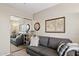 Office features a gray couch and mirrored closet at 6960 E Hacienda La Noria Ln, Gold Canyon, AZ 85118