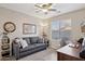 Office space with gray couch, desk and large window at 6960 E Hacienda La Noria Ln, Gold Canyon, AZ 85118