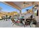 Covered patio with seating area and mountain views at 6960 E Hacienda La Noria Ln, Gold Canyon, AZ 85118