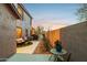 Side yard with seating area and desert landscaping at 6960 E Hacienda La Noria Ln, Gold Canyon, AZ 85118