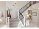 Elegant staircase with black iron railing and carpet at 6960 E Hacienda La Noria Ln, Gold Canyon, AZ 85118