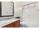 Bathroom features a single vanity, granite countertop, and tub shower combo at 9354 E Hillview Cir, Mesa, AZ 85207