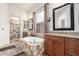 Elegant bathroom with double vanity, soaking tub, and a walk-in shower at 9354 E Hillview Cir, Mesa, AZ 85207