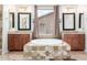 Spa-like bathroom featuring double sinks, a large soaking tub, and stylish tile work at 9354 E Hillview Cir, Mesa, AZ 85207