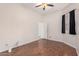 Spacious bedroom with wood flooring and a large window at 9354 E Hillview Cir, Mesa, AZ 85207