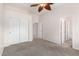 Spacious bedroom with double door closet and access to a full bathroom at 9354 E Hillview Cir, Mesa, AZ 85207