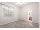 Cozy bedroom with ceiling fan and access to a nearby bathroom at 9354 E Hillview Cir, Mesa, AZ 85207