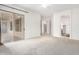 Spacious bedroom with plush carpeting and access to a private bathroom and backyard at 9354 E Hillview Cir, Mesa, AZ 85207