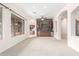Living room with wet bar, built-in shelving and wood-look flooring at 9354 E Hillview Cir, Mesa, AZ 85207