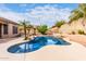Relaxing kidney shaped pool surrounded by lush landscaping at 9354 E Hillview Cir, Mesa, AZ 85207