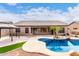 Stunning kidney-shaped pool with a large backyard and gazebo at 9354 E Hillview Cir, Mesa, AZ 85207