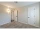 A bright bedroom is carpeted and has an ensuite bathroom at 11085 E Becker E Ln, Scottsdale, AZ 85259
