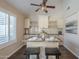 Cozy breakfast bar featuring granite countertops, white cabinets, and pendant lighting, creating a welcoming space at 11085 E Becker E Ln, Scottsdale, AZ 85259